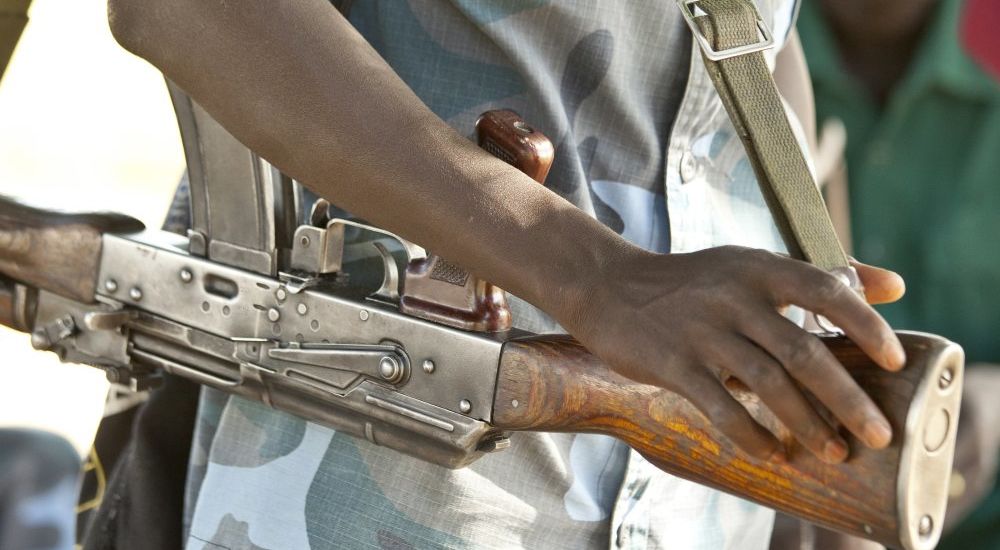 African soldier holding rifle in South Sudan