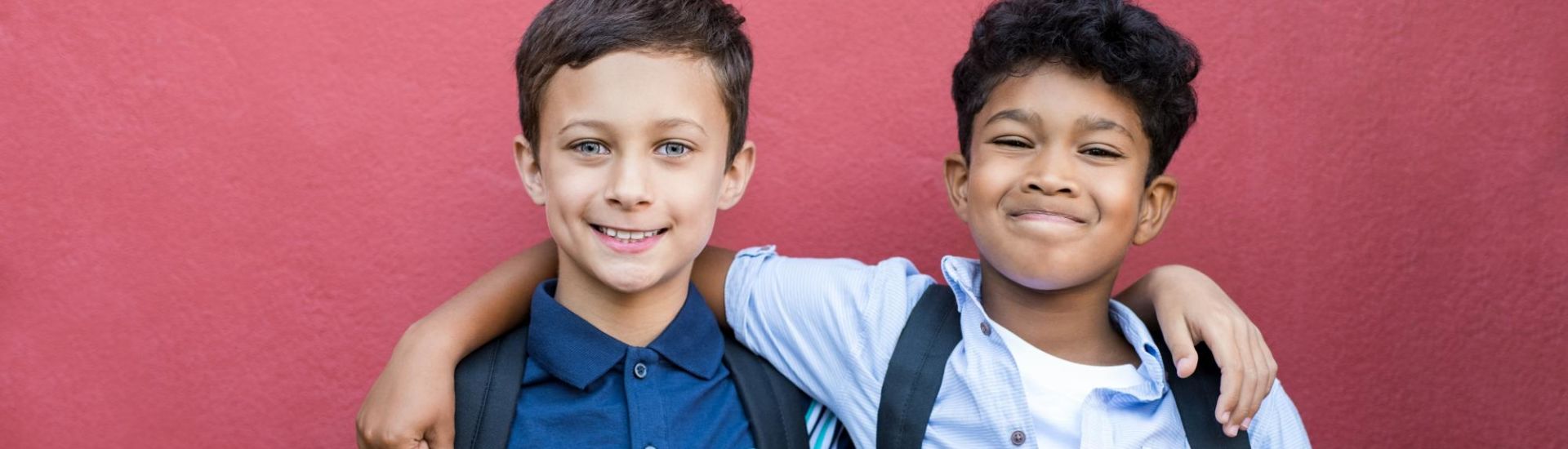 Smiling children friends embracing