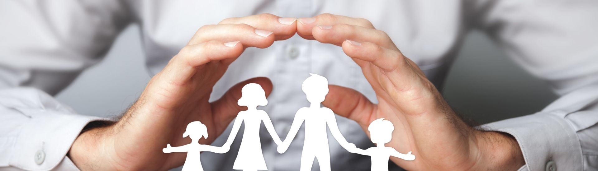 Protecting Hands Over Paper Family / Family Protection And Care Concept