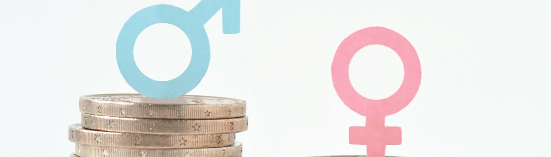 Male and female symbols on piles of coins – Gender pay equality concept
