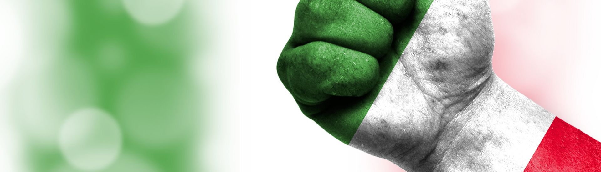 Flag of Italy painted on male fist, concept of conflict