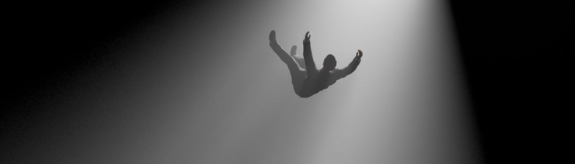 man falling into a hole