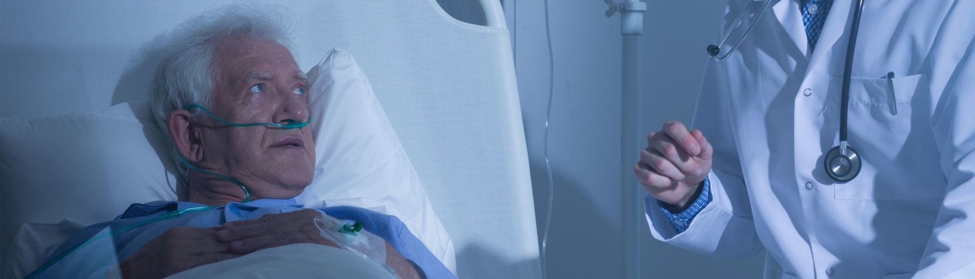 Elder patient looking at doctor