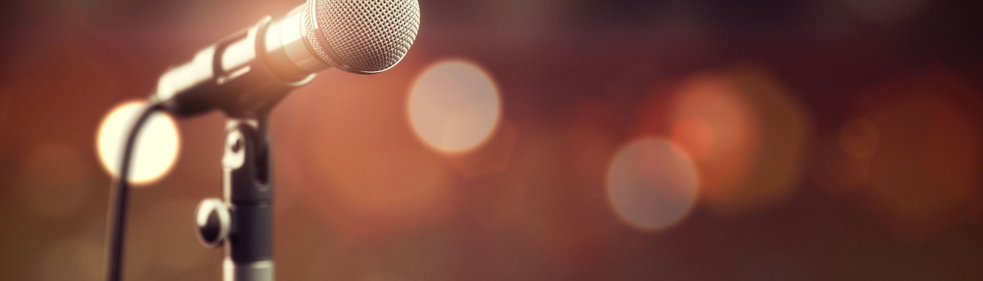 Microphone on abstract background. Audio, music, multimedia