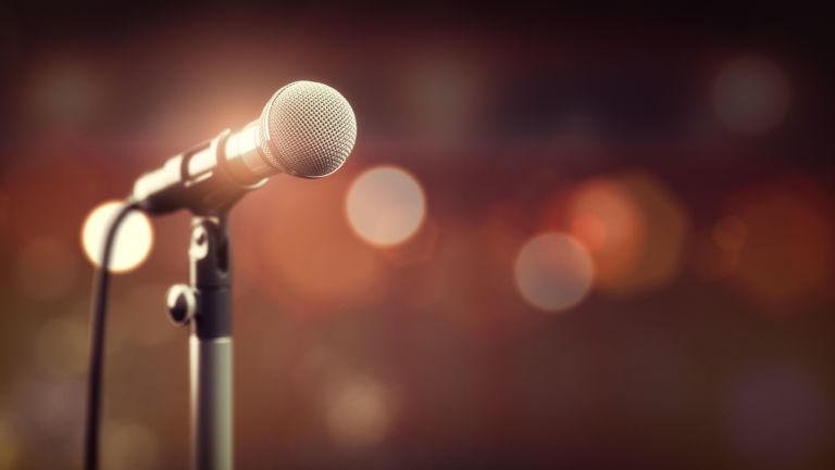Microphone on abstract background. Audio, music, multimedia