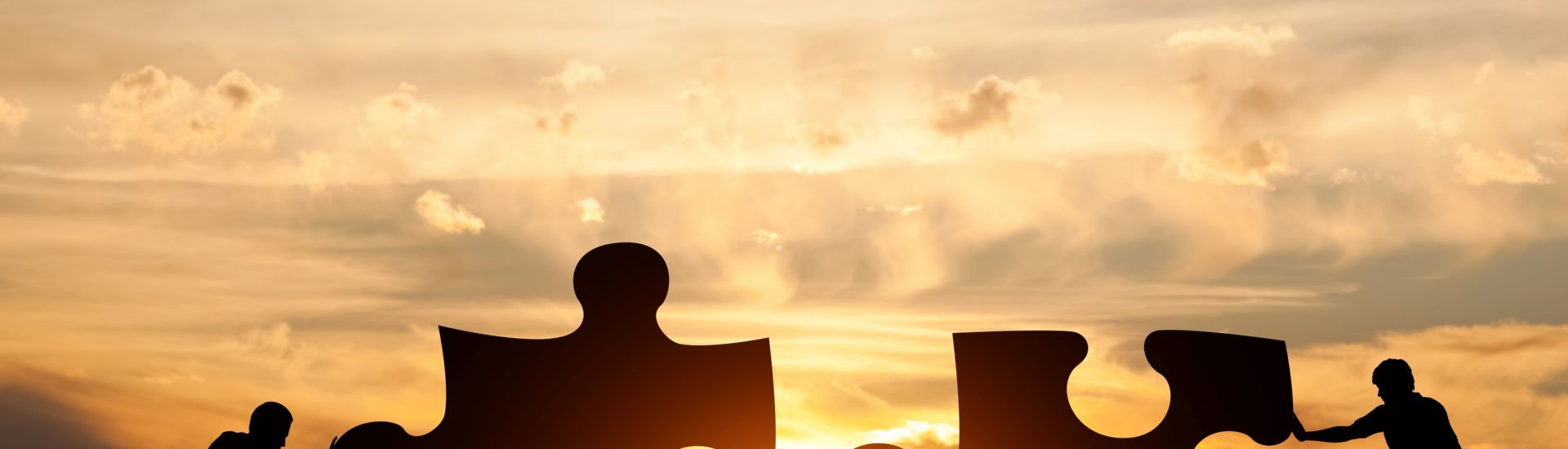 Two men connect two puzzle pieces. Concept of business solution, solving a problem.