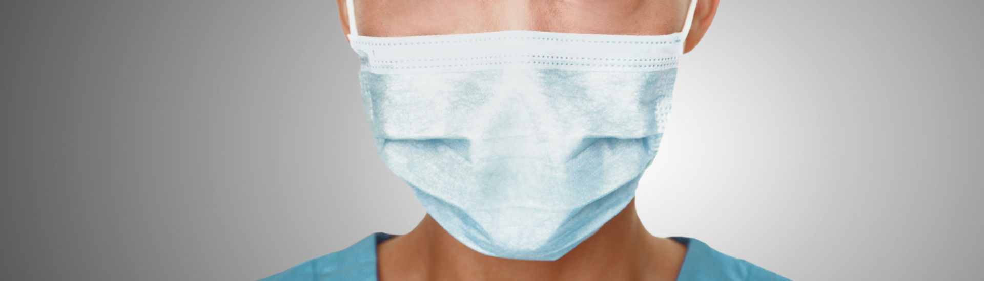 Coronavirus surgical mask doctor wearing face protective mask against corona virus banner panoramic medical professional preventive gear.