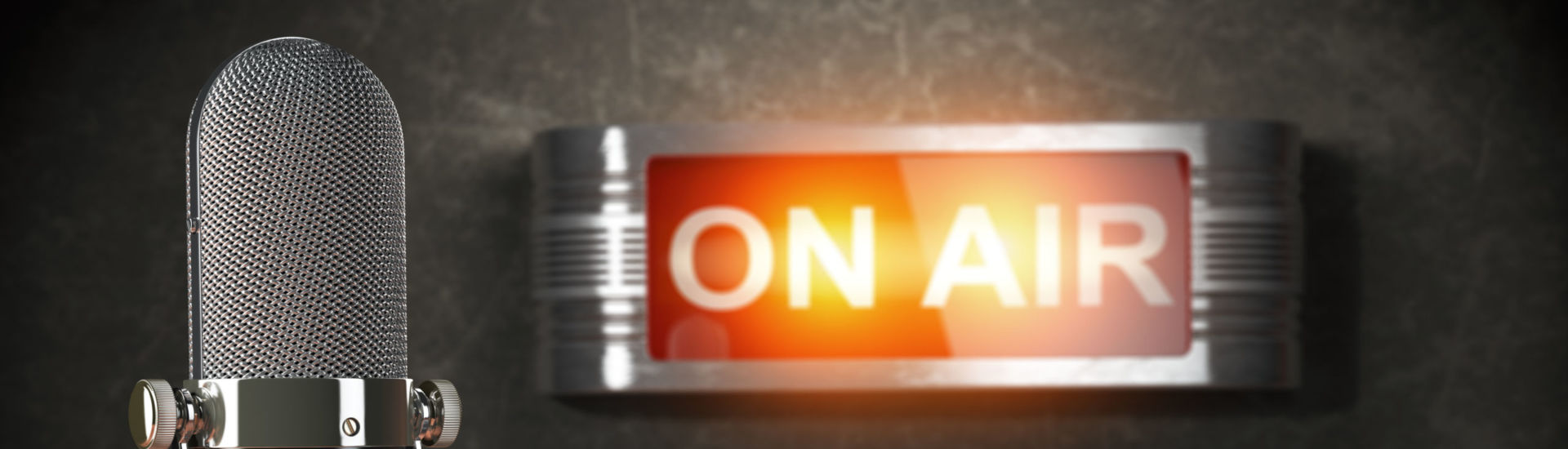 Vintage microphone  and headphones with signboard on air. Broadcasting radio station concept.