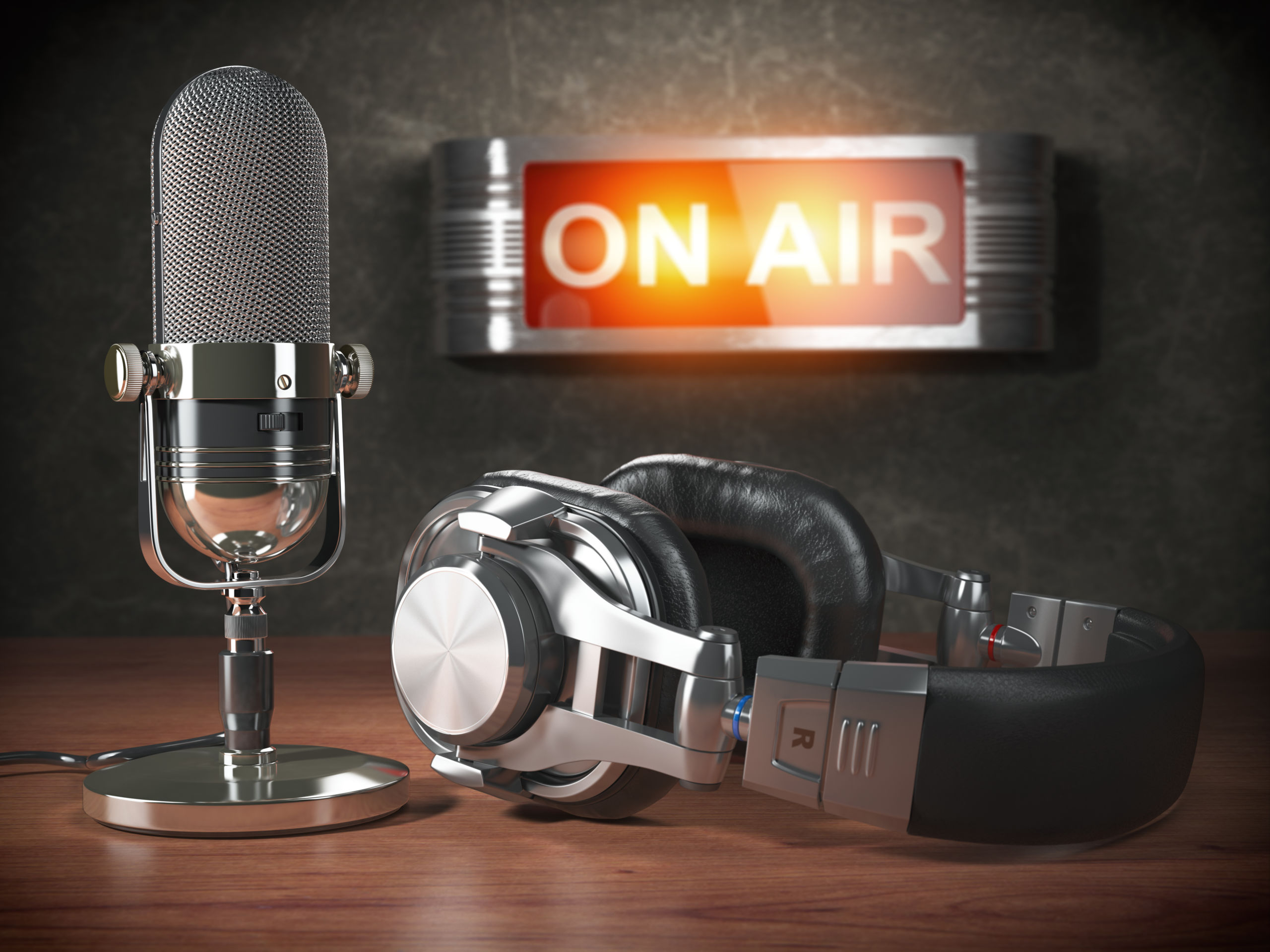 Vintage microphone  and headphones with signboard on air. Broadcasting radio station concept.