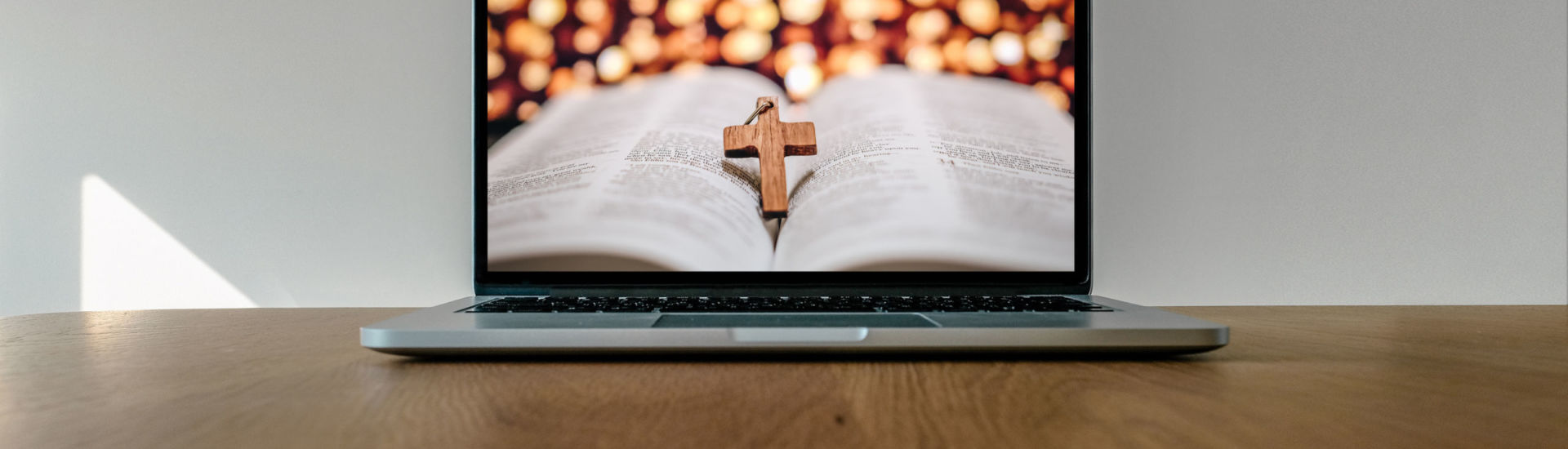 Worship from home, Online live church for sunday service, Laptop screen with cross and bible photo, quarantine for Covid 19 situation