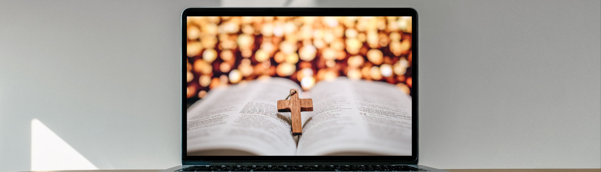 Worship from home, Online live church for sunday service, Laptop screen with cross and bible photo, quarantine for Covid 19 situation