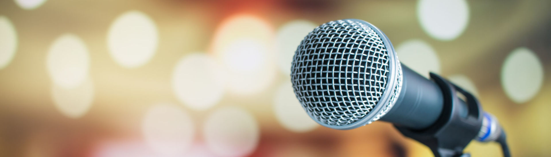 Microphone for speaker on abstract blurred of speech in seminar room or speaking conference for audience at university