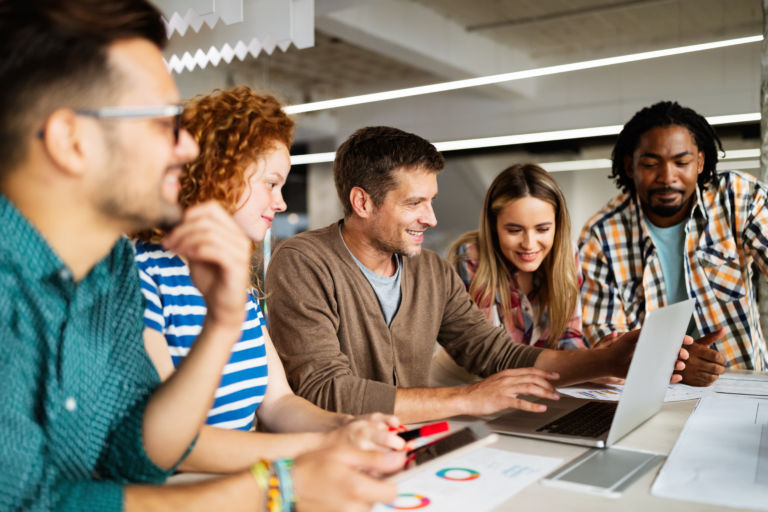Group of diverse designers, business people brainstorming on meeting in office
