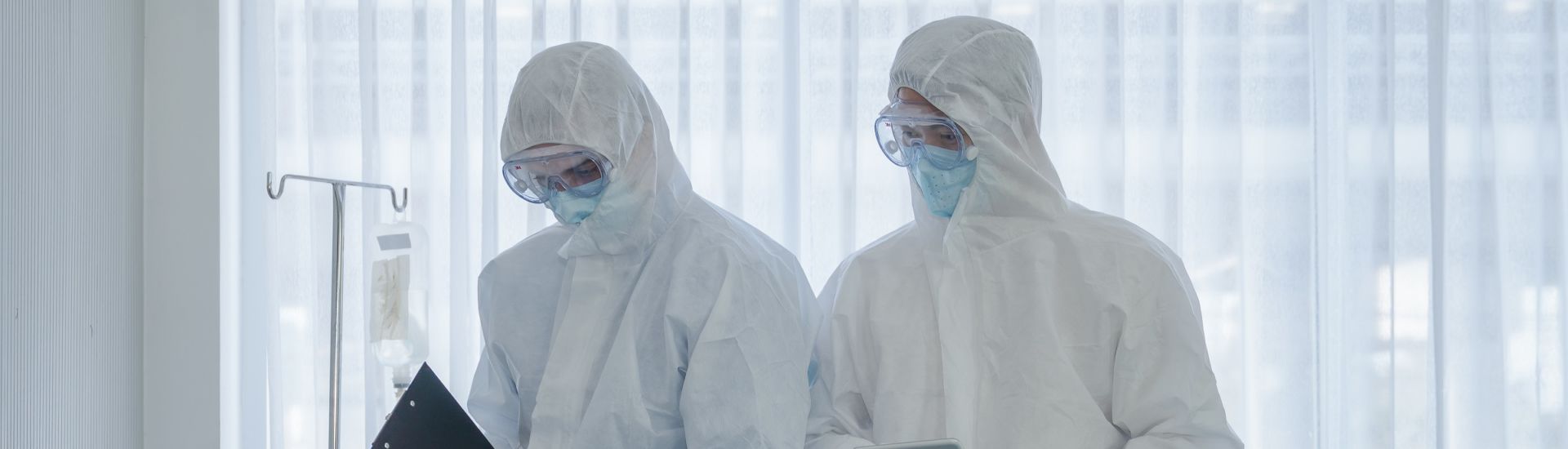 coronavirus covid 19 treatment background of coronavirus covid 19 patient on bed with doctors in PPE coverall suit in hospital negative pressure quarantine room, coronavirus covid 19 disease treatment