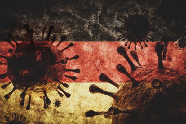 Coronavirus against Germany grunge flag. Virus causing epidemic