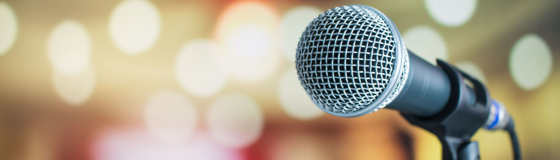 Microphone for speaker on abstract blurred of speech in seminar room or speaking conference for audience at university