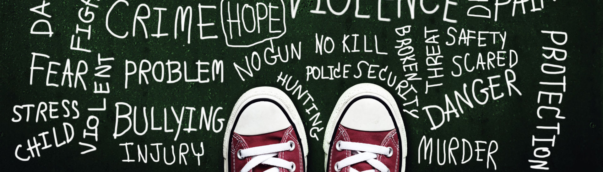 bullying children concept. red sneaker on chalkboard with keyword about bully problem in school campaign
