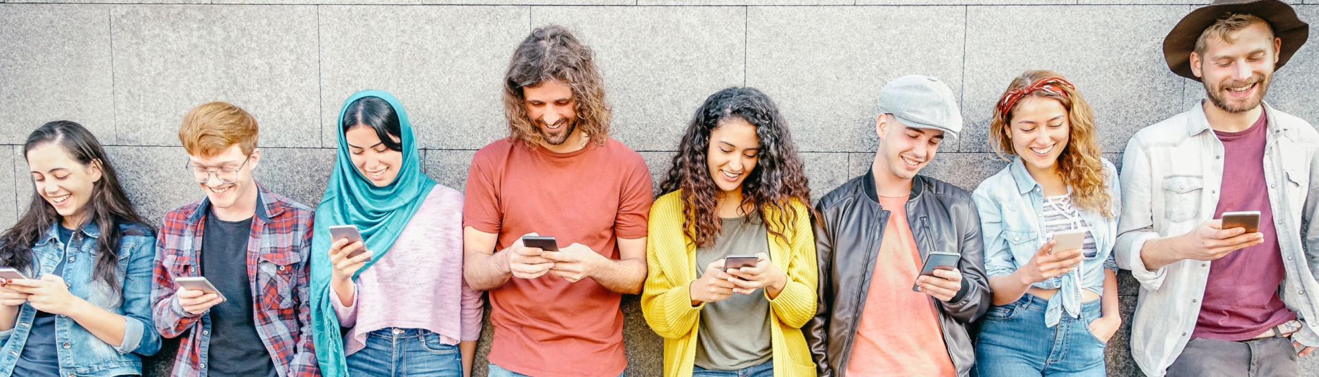 Group of fashion friends watching on their smart mobile phones – Millennial generation z addicted to new technology trends – Concept of people, tech, social media, friendship and youth lifestyle
