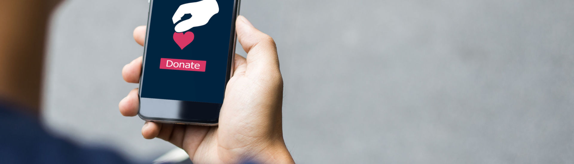 e-donation concept.close-up of man hands make an online donate v