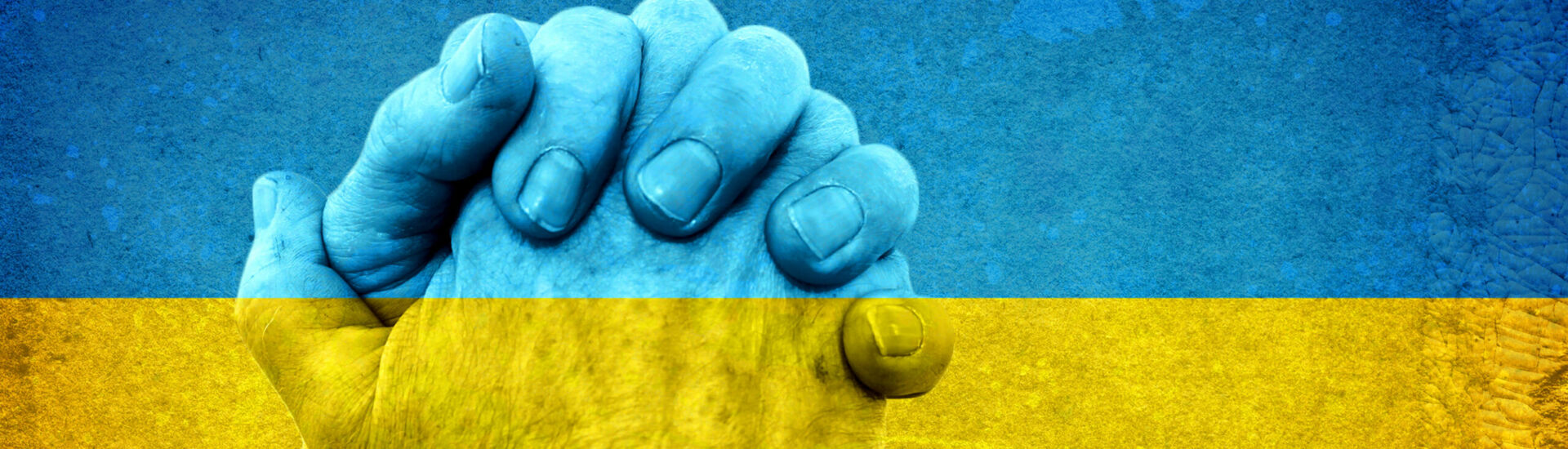Hands on Ukrainian Flag