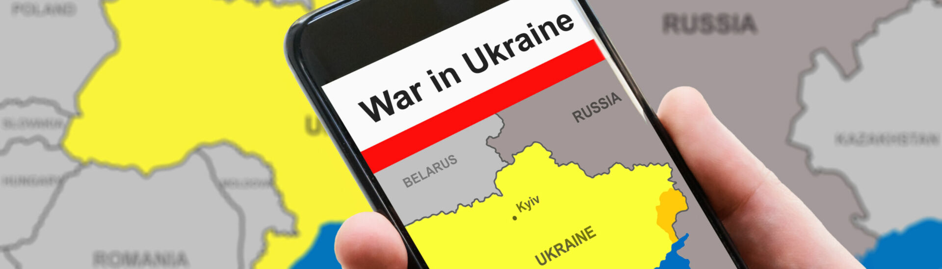 War in Ukraine on mobile phone screen