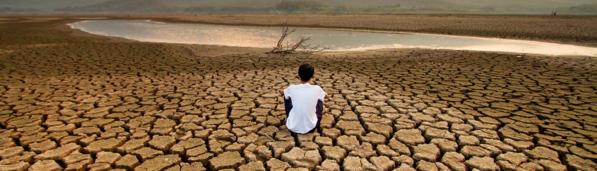 Climate change and global warming concept. Children sitting on d