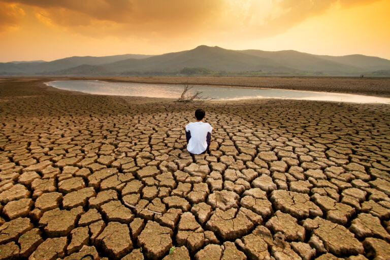 Climate change and global warming concept. Children sitting on d