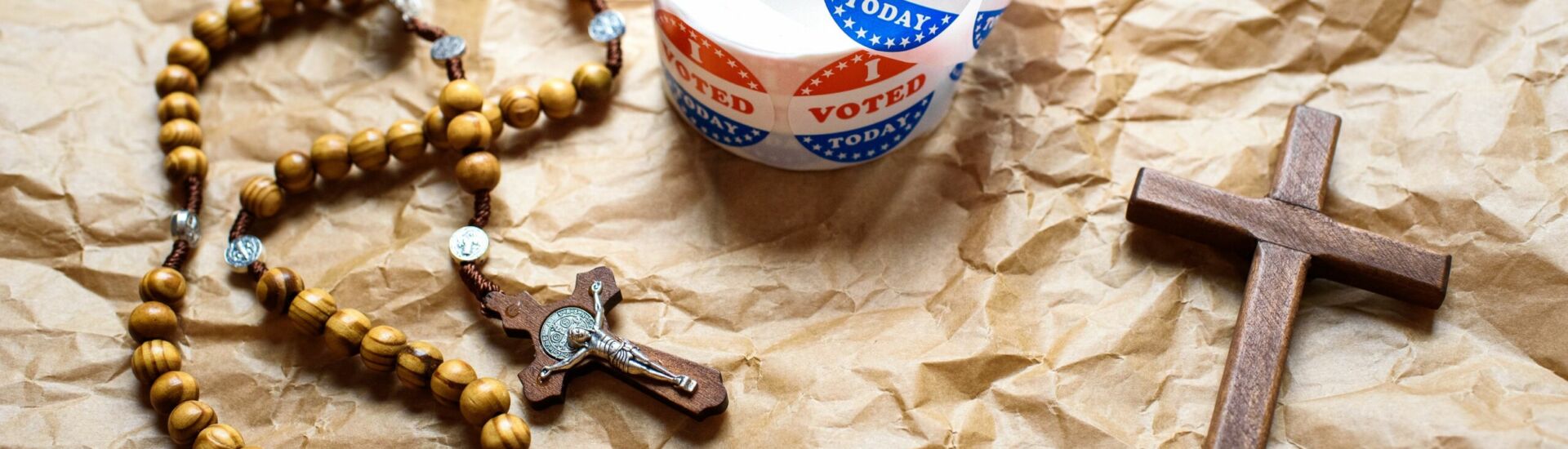 Christian cross and rosary next to the concept of American presi