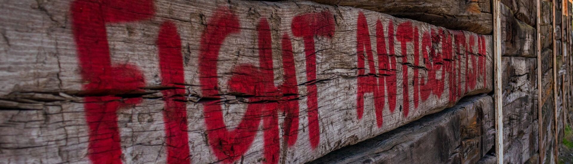 Red text against antisemitism