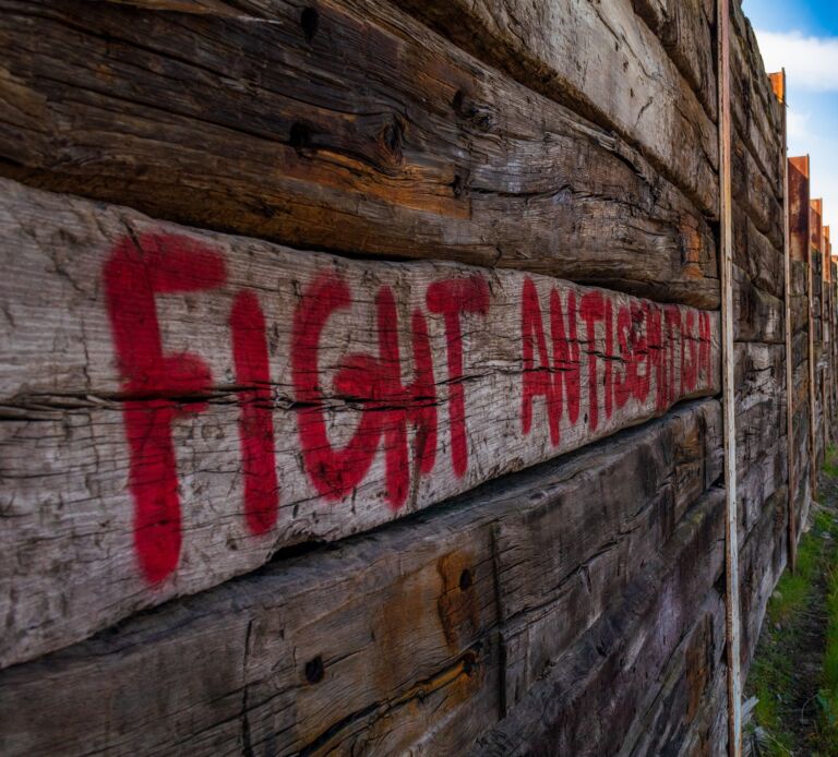 Red text against antisemitism