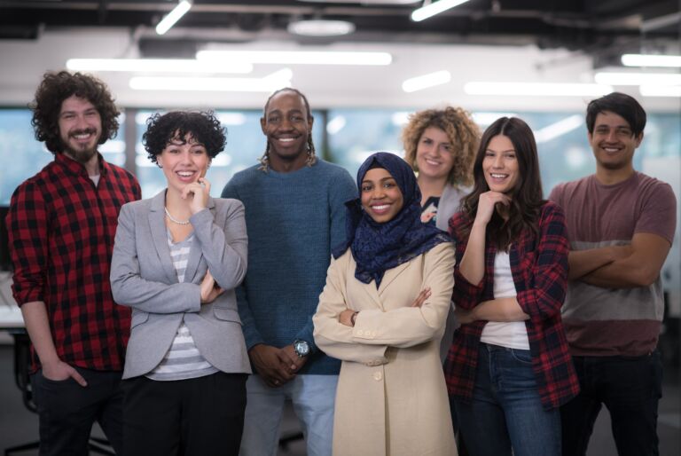 portrait of young excited multiethnics business team