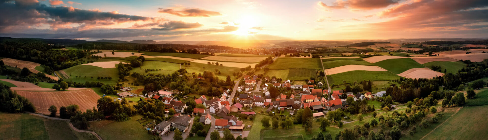 Aerial panorama of a village at sunrise