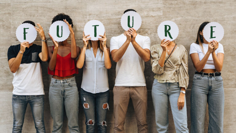 Group of young people hiding their face with the world Future –