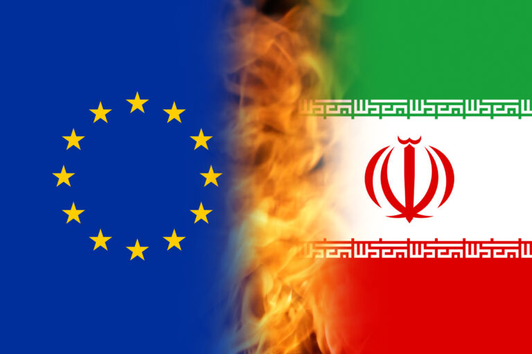 Defocus Iran sanctions concept. Iranian flag, concept on the top