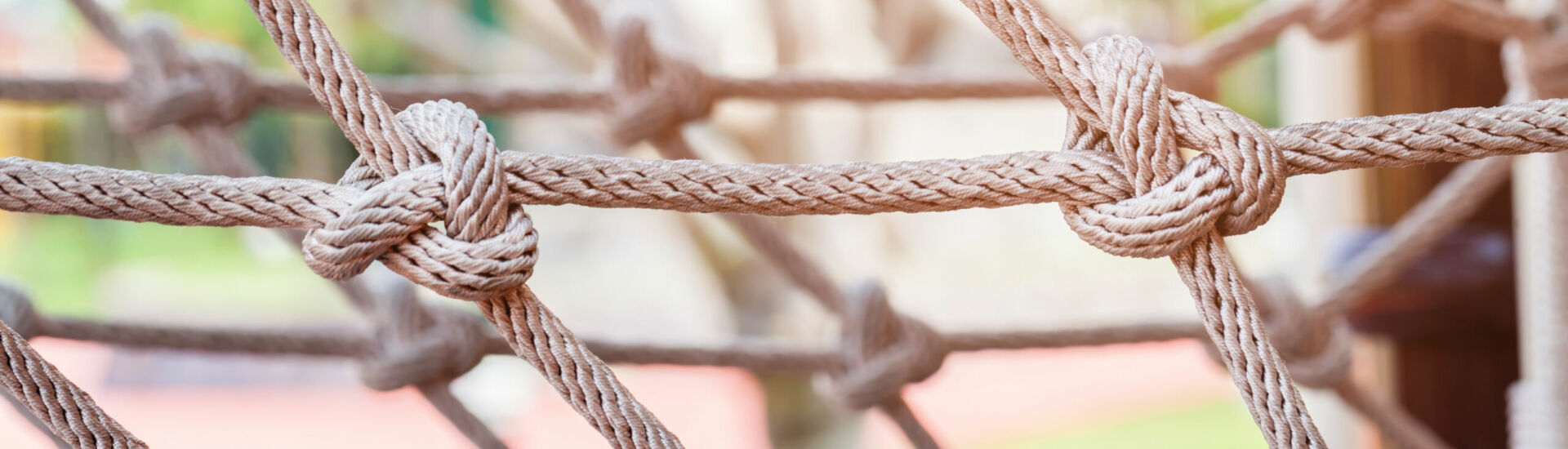 Close-up of rope knot line tied together with playground background.selective focus.
