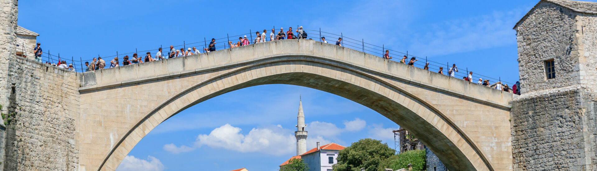 MOSTAR, BOSNIA HERZEGOVINA – 2017 AUGUST 16. The Old Bridge joins east and west Mostar and for many, tells a story of hope and reconciliation after the battle.