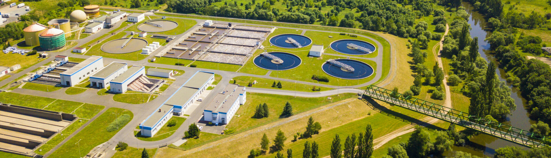 Aerial view of sewage treatment plant. Industrial water treatment for big city from drone view. Waste water management.