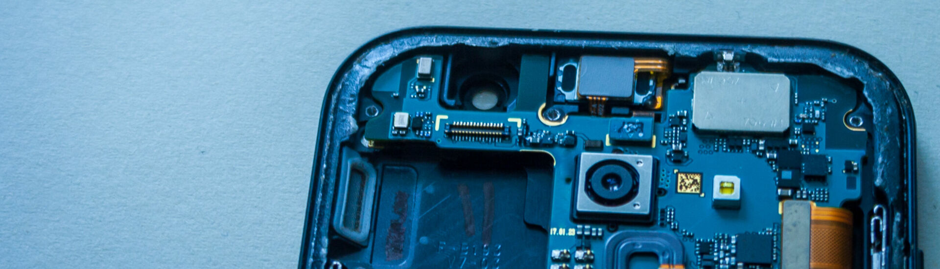 Repair faulty mobile phone on desk. concept of computer hardware, mobile phone, electronic, repairing, upgrade and technology.