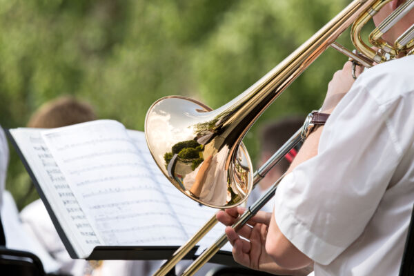 Men playing his trombone