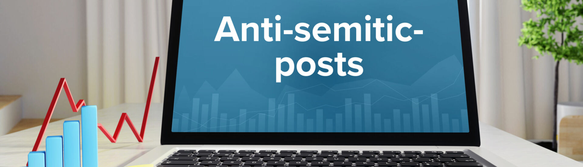 Anti-semitic-posts. Statistics/Business. Laptop in the office with term on the Screen. Finance/Economy.