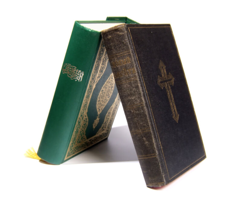 Bible and Koran leaning on each other