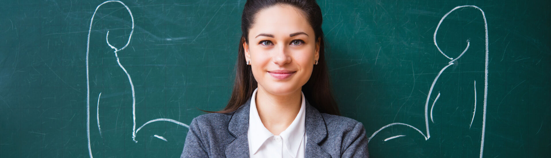 smiling teacher near the board