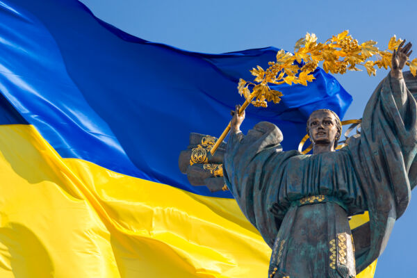 Monument of Independence of Ukraine in front of the Ukrainian fl