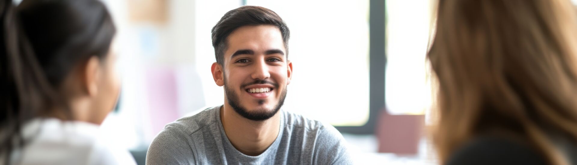 The expression of a social worker providing counseling to at-risk youth in a community center, Symbolizing empathy and support in social services, close-up photography style