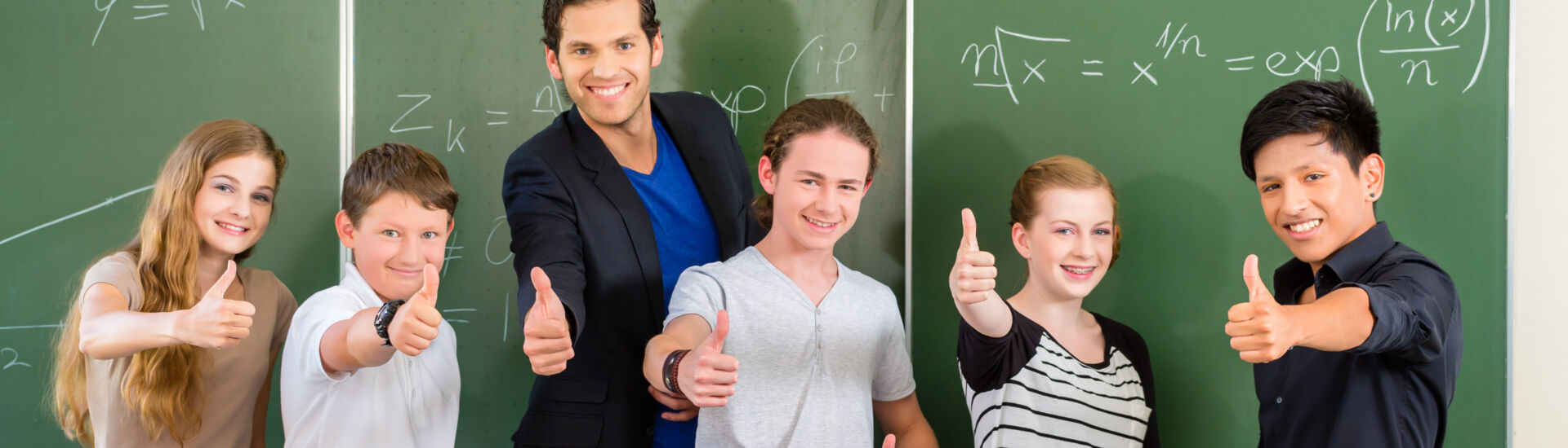 Teacher motivating students in school class