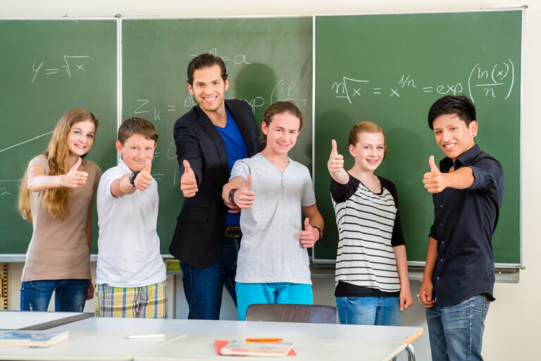 Teacher motivating students in school class