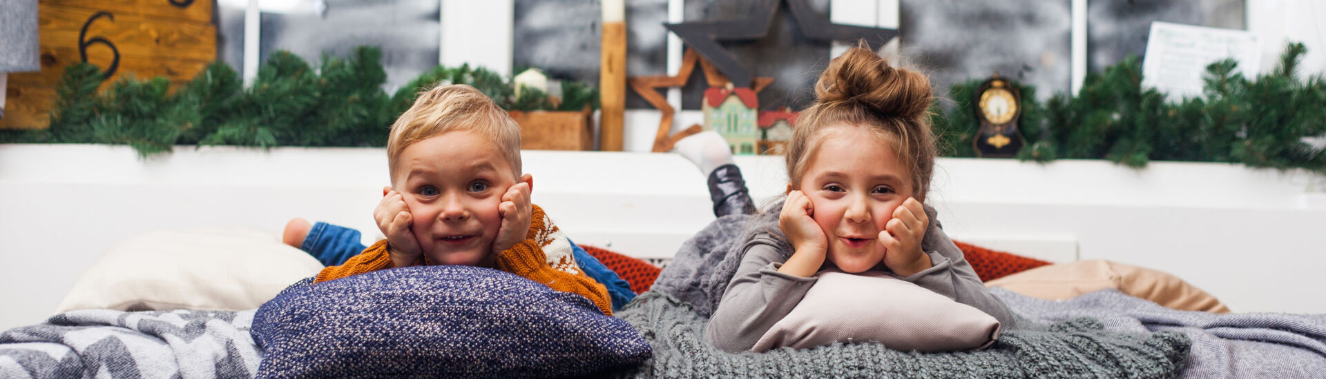 Cute little kids, boy and girl at home waiting for Santa Claus