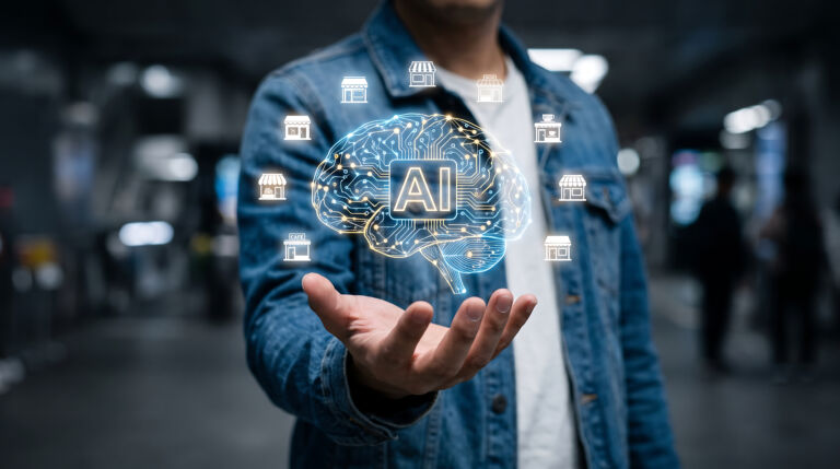 Artificial intelligence concept with a human hand holding glowing icons of small businesses and a brain illustration
